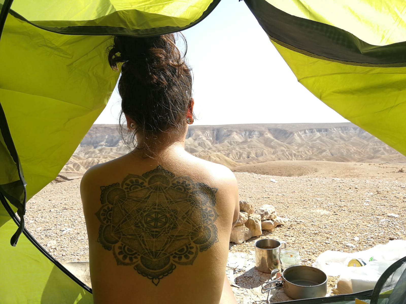 back tattoo in a tent